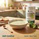 Миска теплого овочевого супу Nutripharma з парою на дубовому столі, поряд туба 600 г, livestashop